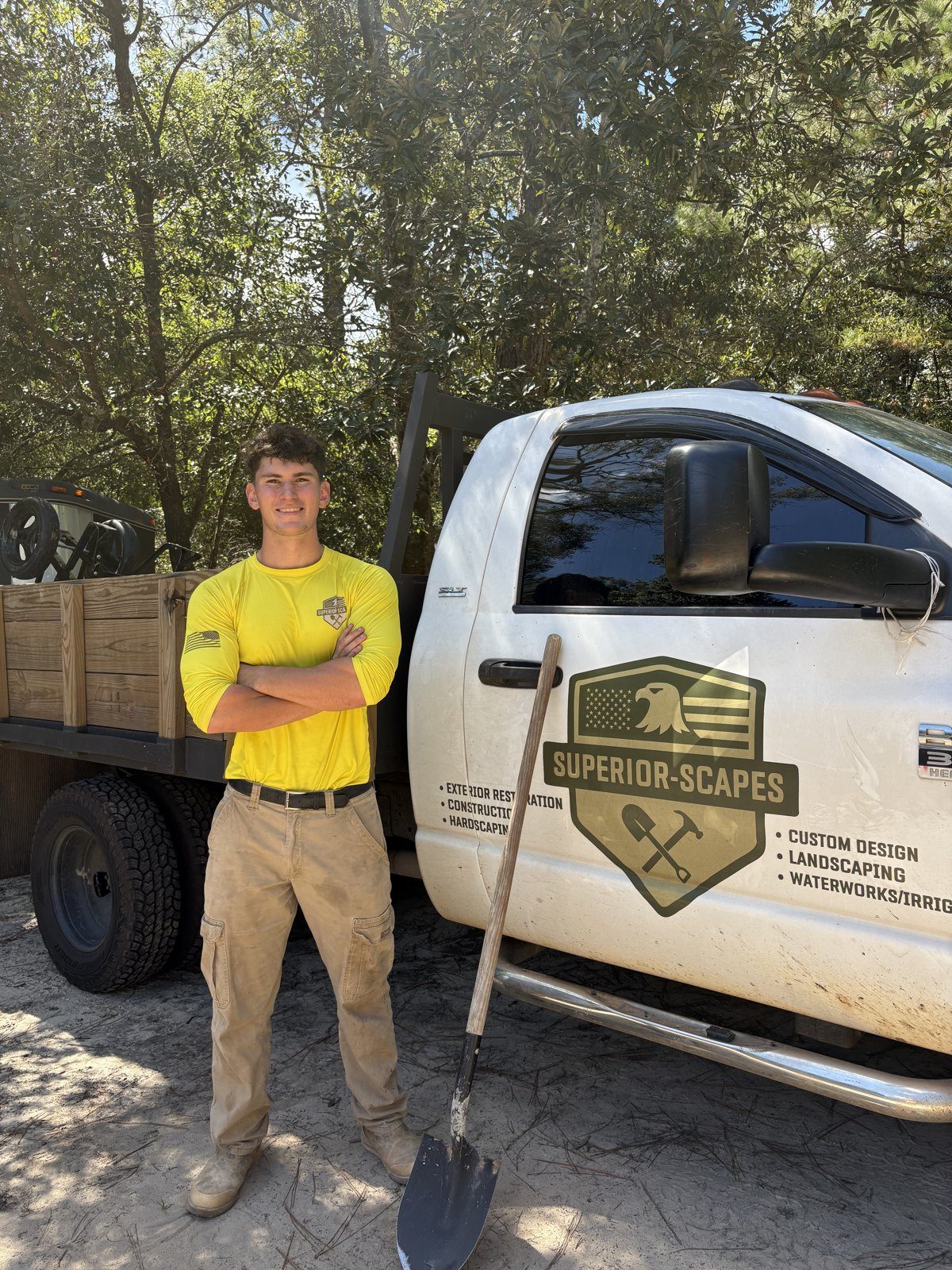 James Scogin with a shovel beside the Superior Scapes truck