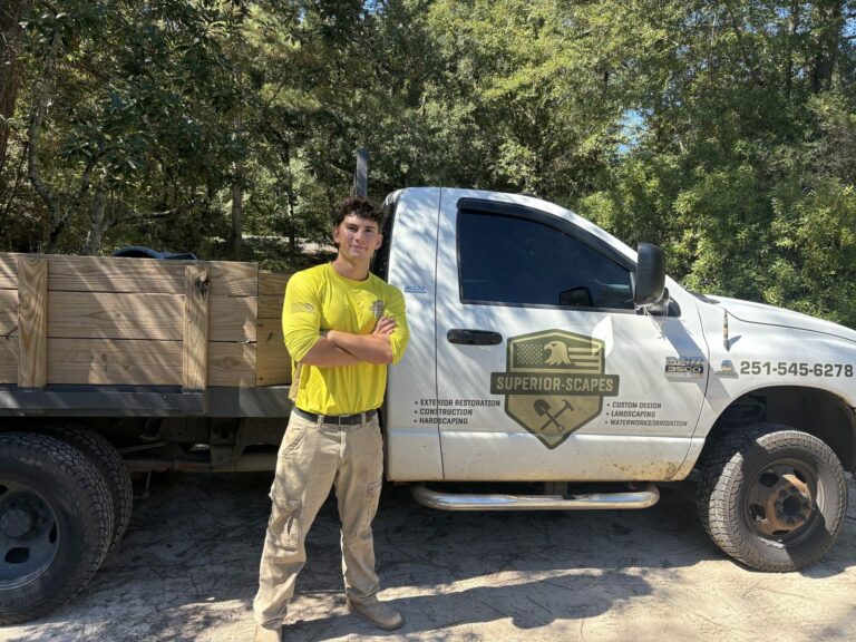 James Scogin, owner of Superior Scapes, beside the company truck