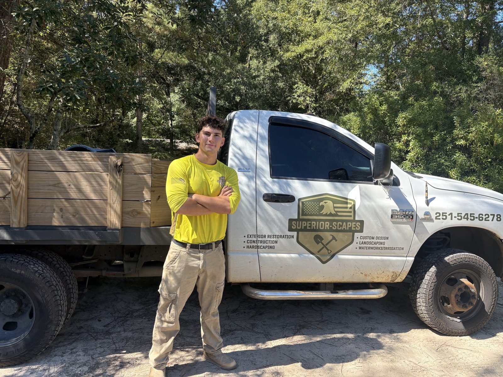 James Scogin, owner of Superior Scapes, beside the company truck