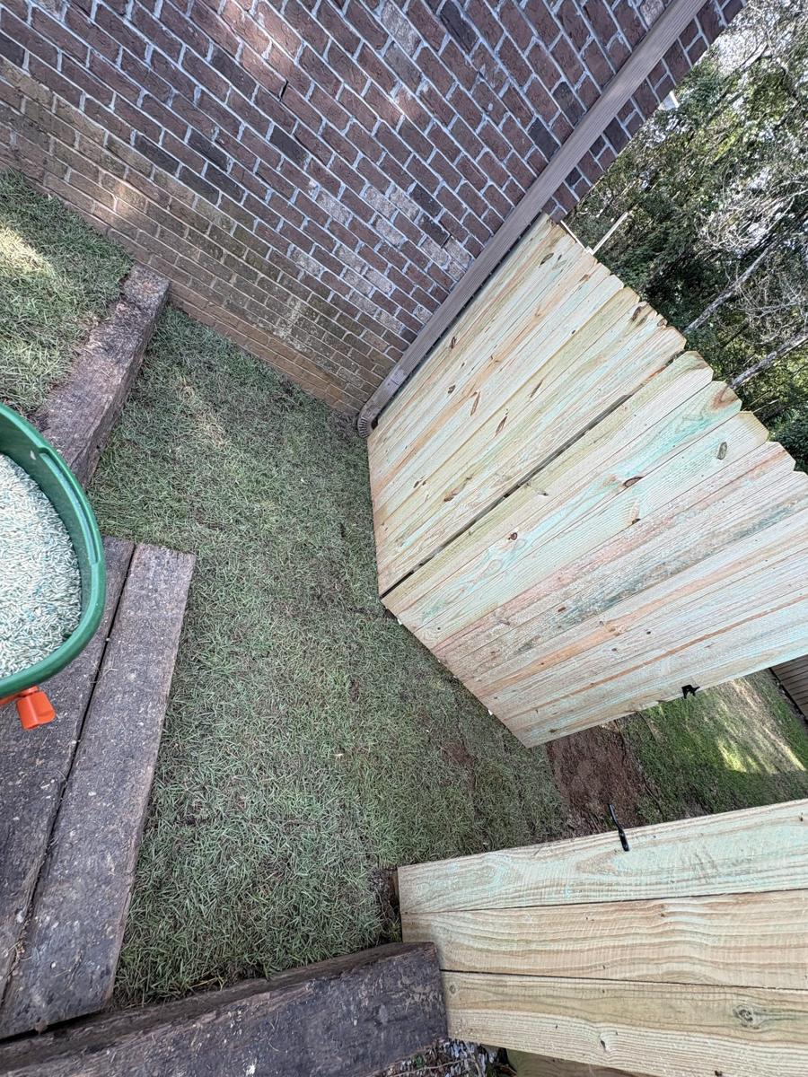 Timber steps and wall in a narrow side yard