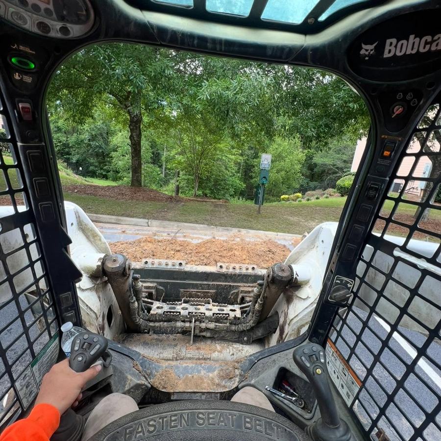 View from the seat of a skid steer on a job site