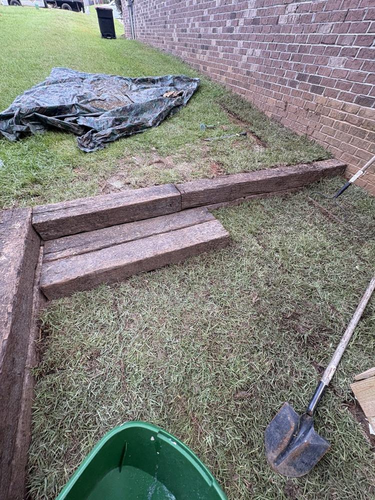 Timber border set around a side-yard bed