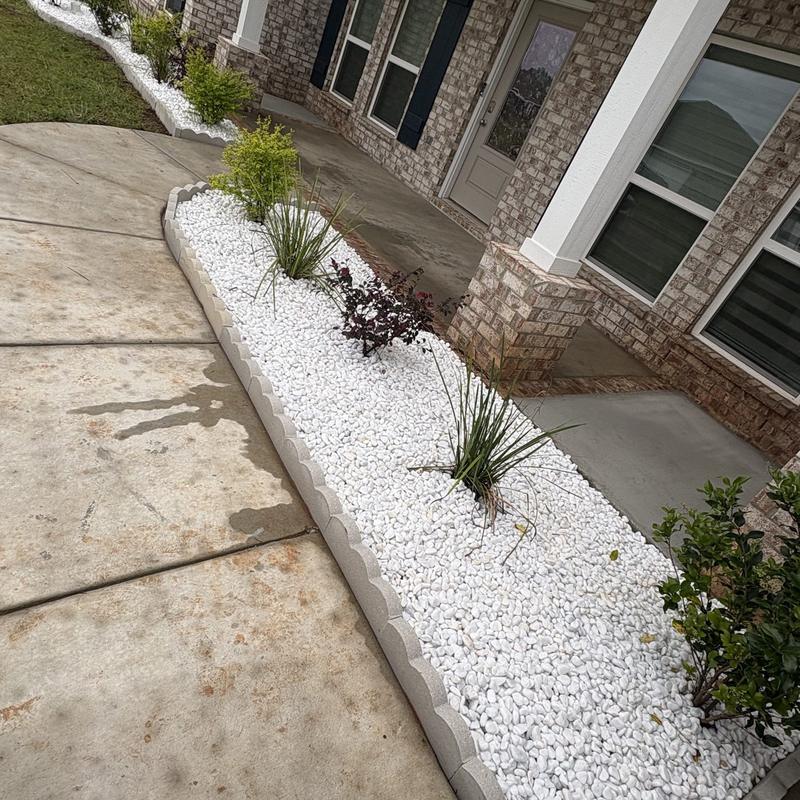 White rock bed along a front walkway